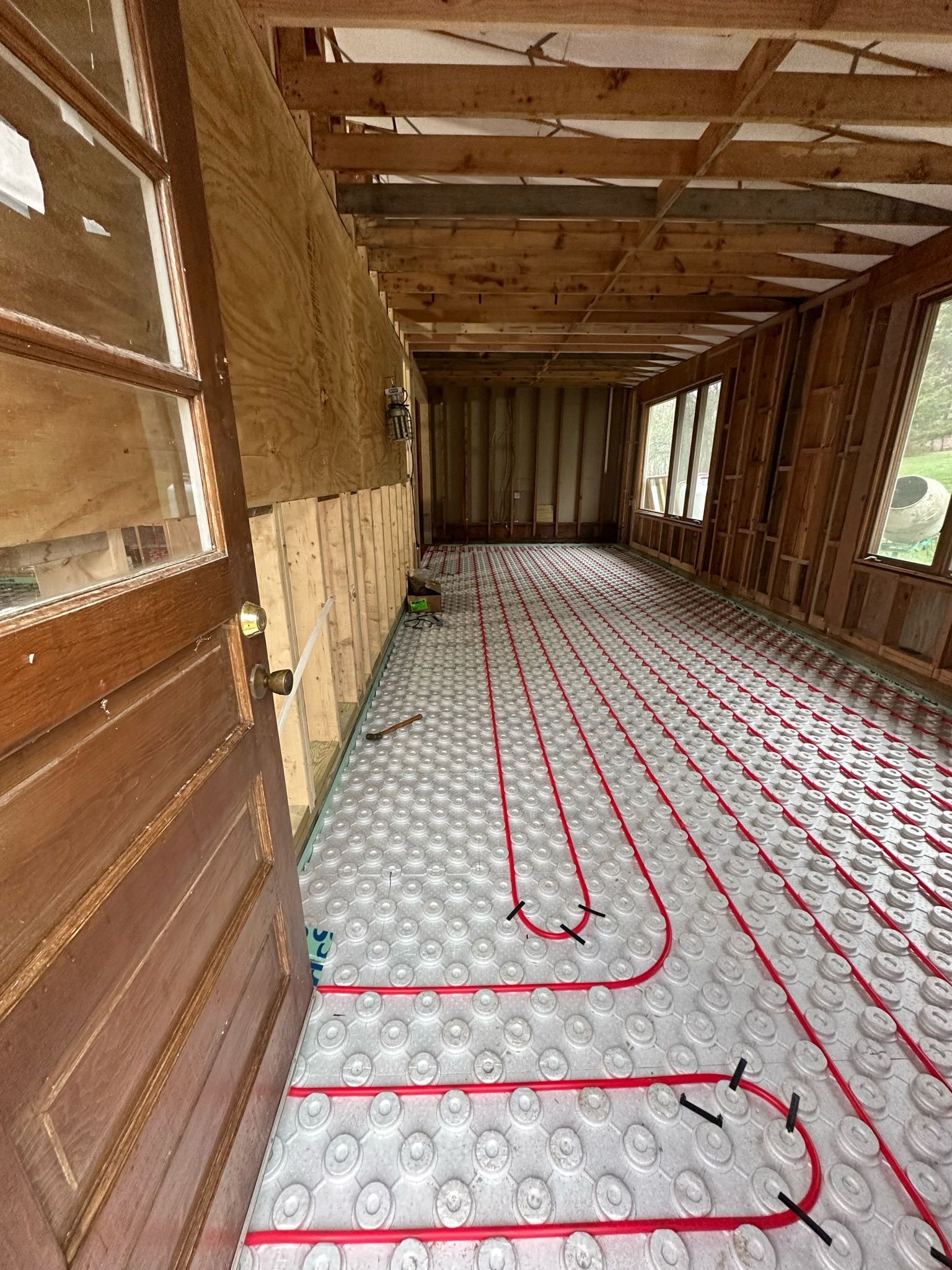 a hallway with a lot of pipes on the floor