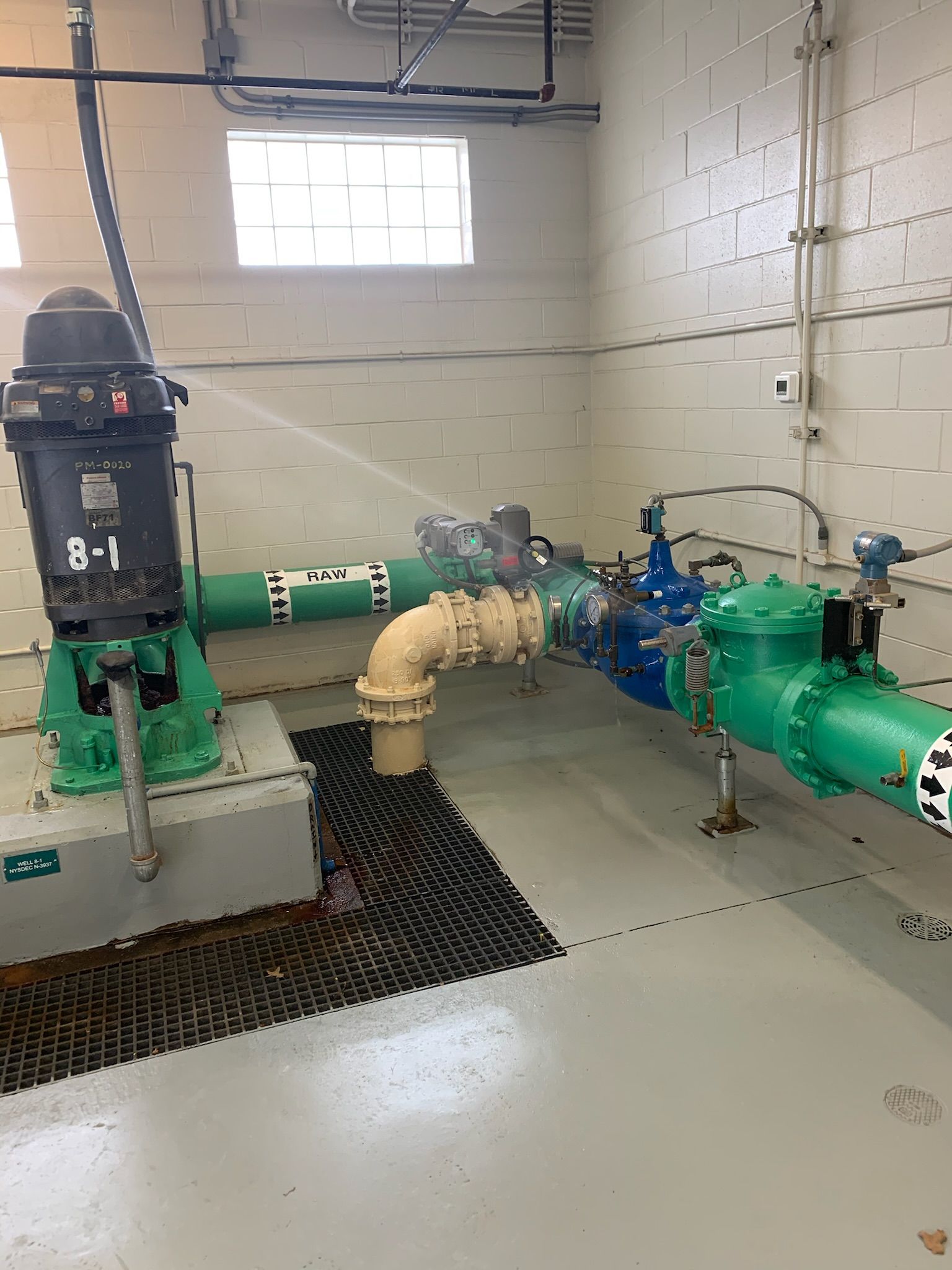 a room with a lot of pipes and pumps in it