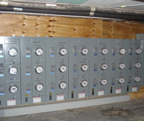 a row of electrical panels with buttons on them