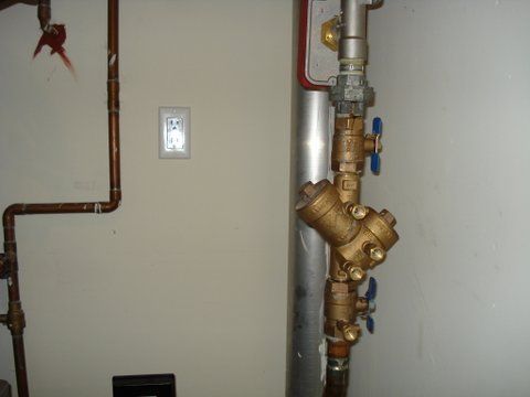 a copper pipe with a valve attached to it