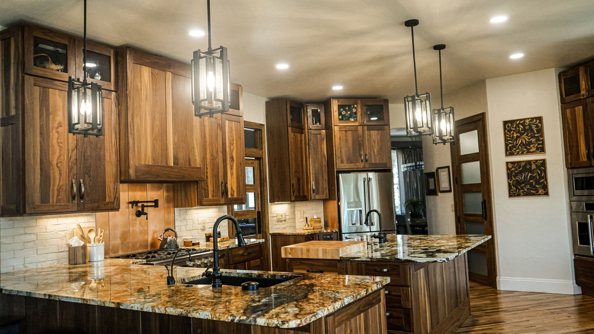 A kitchen with wooden cabinets and granite counter tops.
