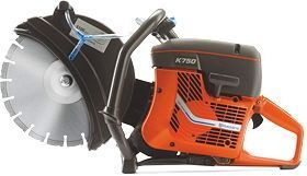 Orange and black gas-powered cut-off saw with a large circular blade on a white background