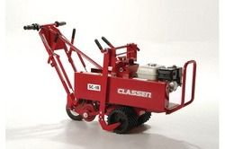 Red Classen utility machine with wheels and front lifting arm on a white background