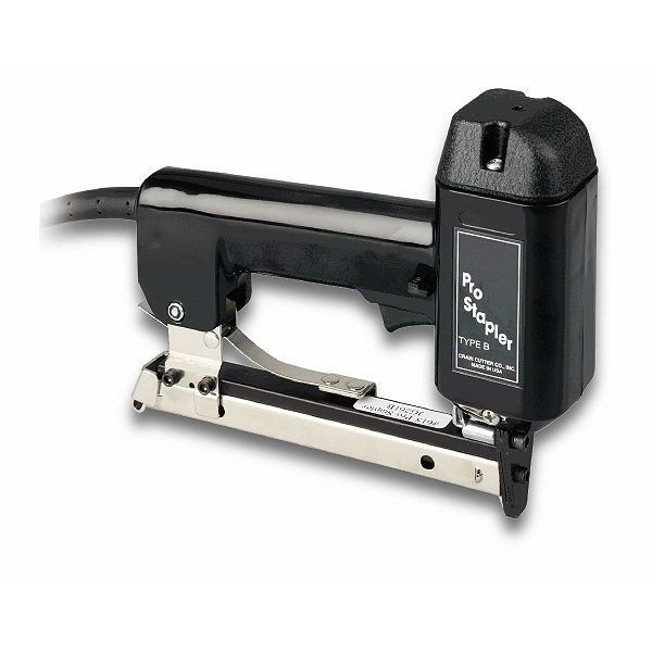 Black-and-silver desktop stapler with a power cord and front-loading magazine on a white background