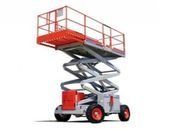 Red scissor lift with white railings raised to working height