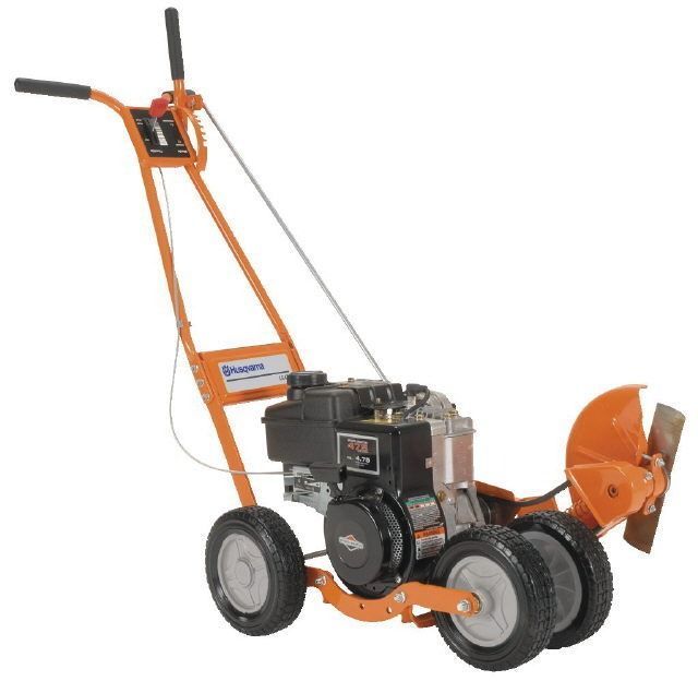 Orange-and-black walk-behind snowblower with wheels and chute on a white background