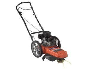 Orange push lawn mower with black handle and wheels on a white background