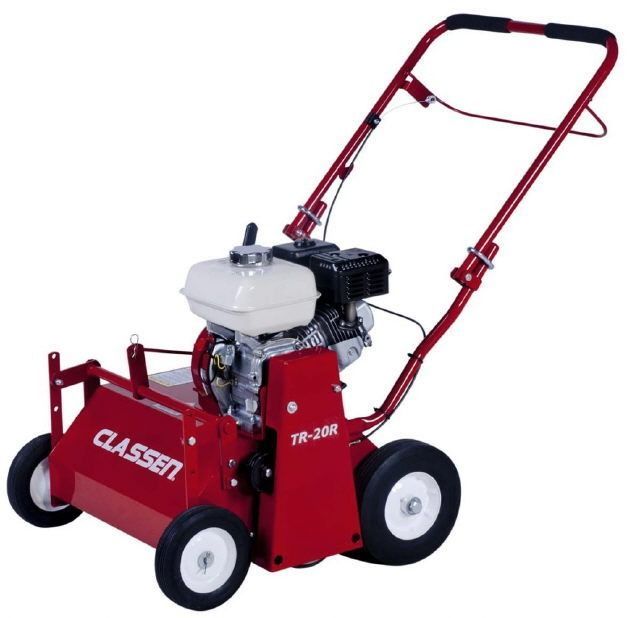 Red handheld lawn aerator with white engine, black wheels, and red frame on a white background