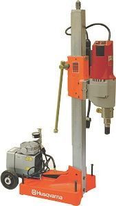 Husqvarna orange-and-gray drill rig with engine mounted on a vertical stand.