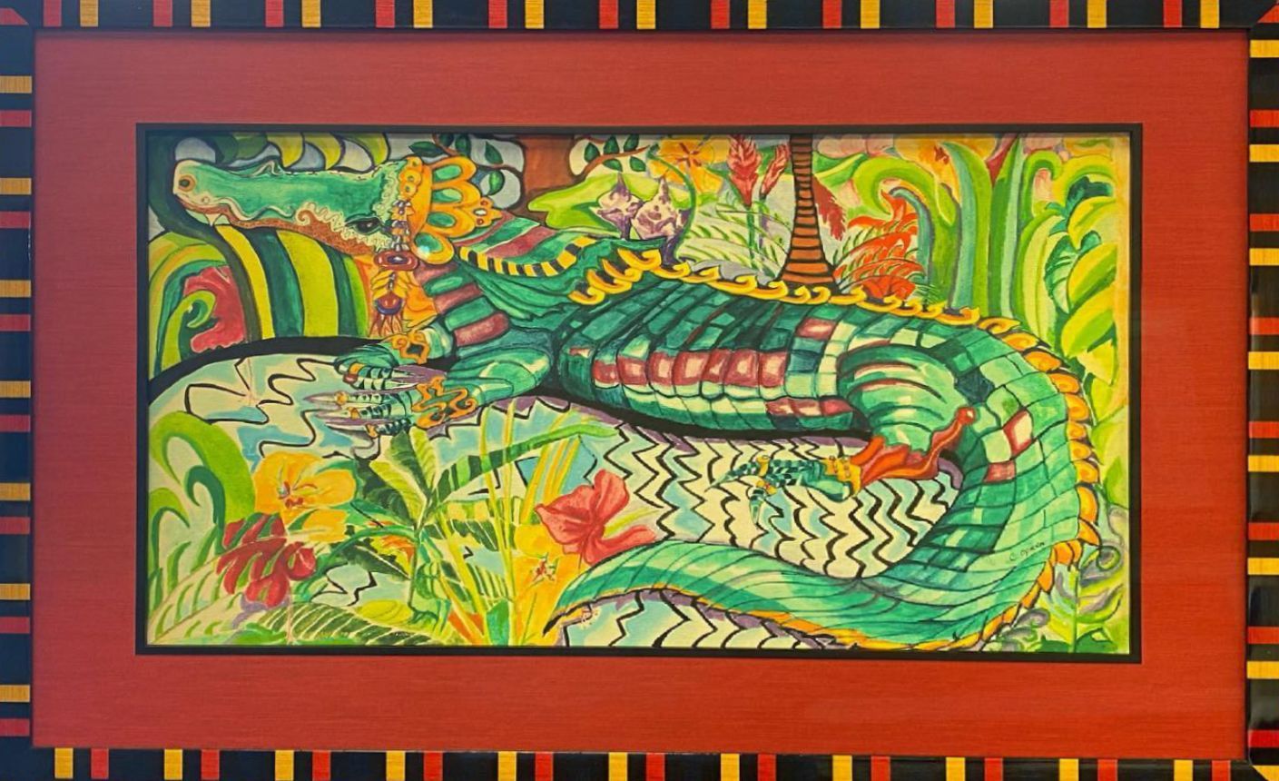 A colorful drawing of an alligator resting in foliage, framed in red with a black and yellow border.