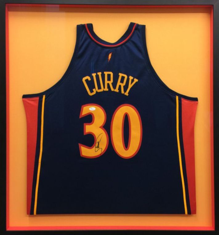 Framed Golden State Warriors jersey with 