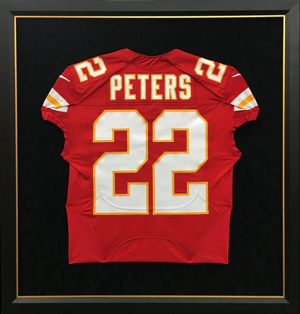 Framed Kansas City Chiefs football jersey, red with white numbers (22) and 