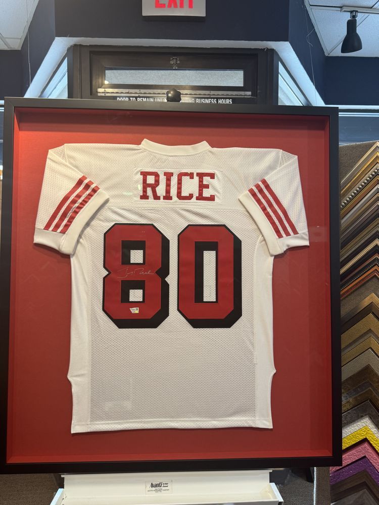 Framed white football jersey with the name