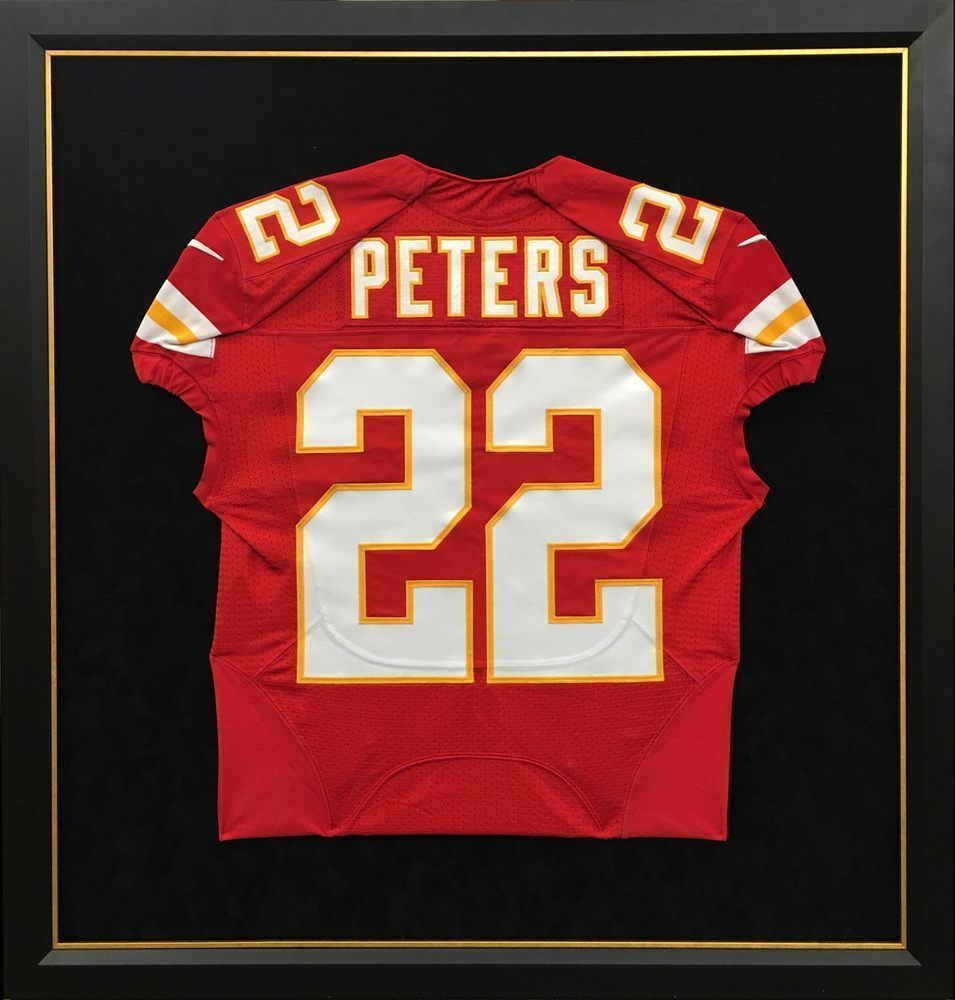 Framed Kansas City Chiefs football jersey, red with white numbers (22) and
