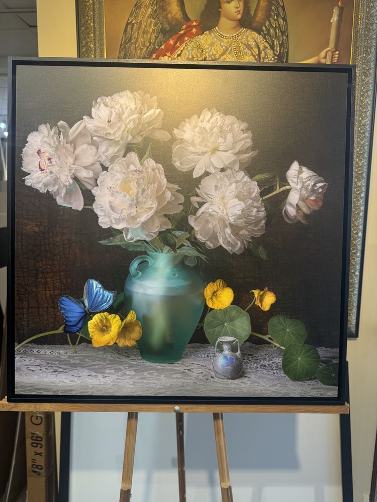 still life painting: white peonies in a teal vase, butterfly, yellow flowers, and antique details on a table