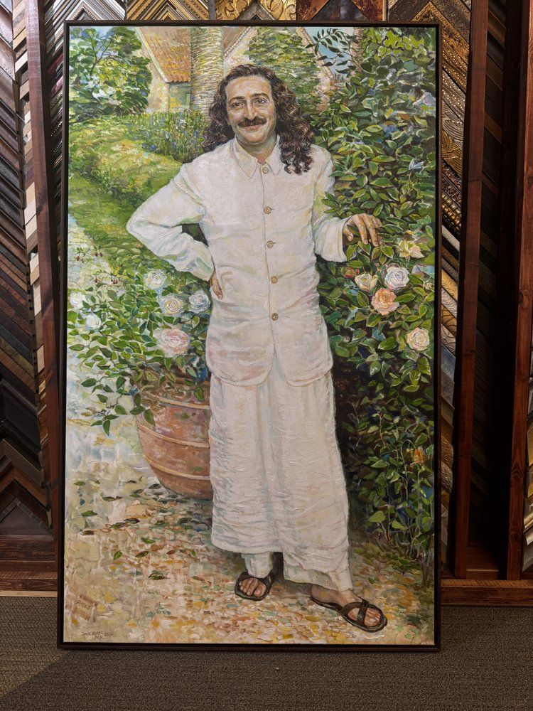 man in white suit poses by roses, leaning against hedge in garden; framed art
