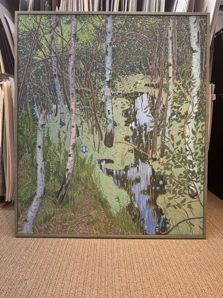 painting of a forest scene with birch trees, a stream, and green foliage, framed and displayed indoors