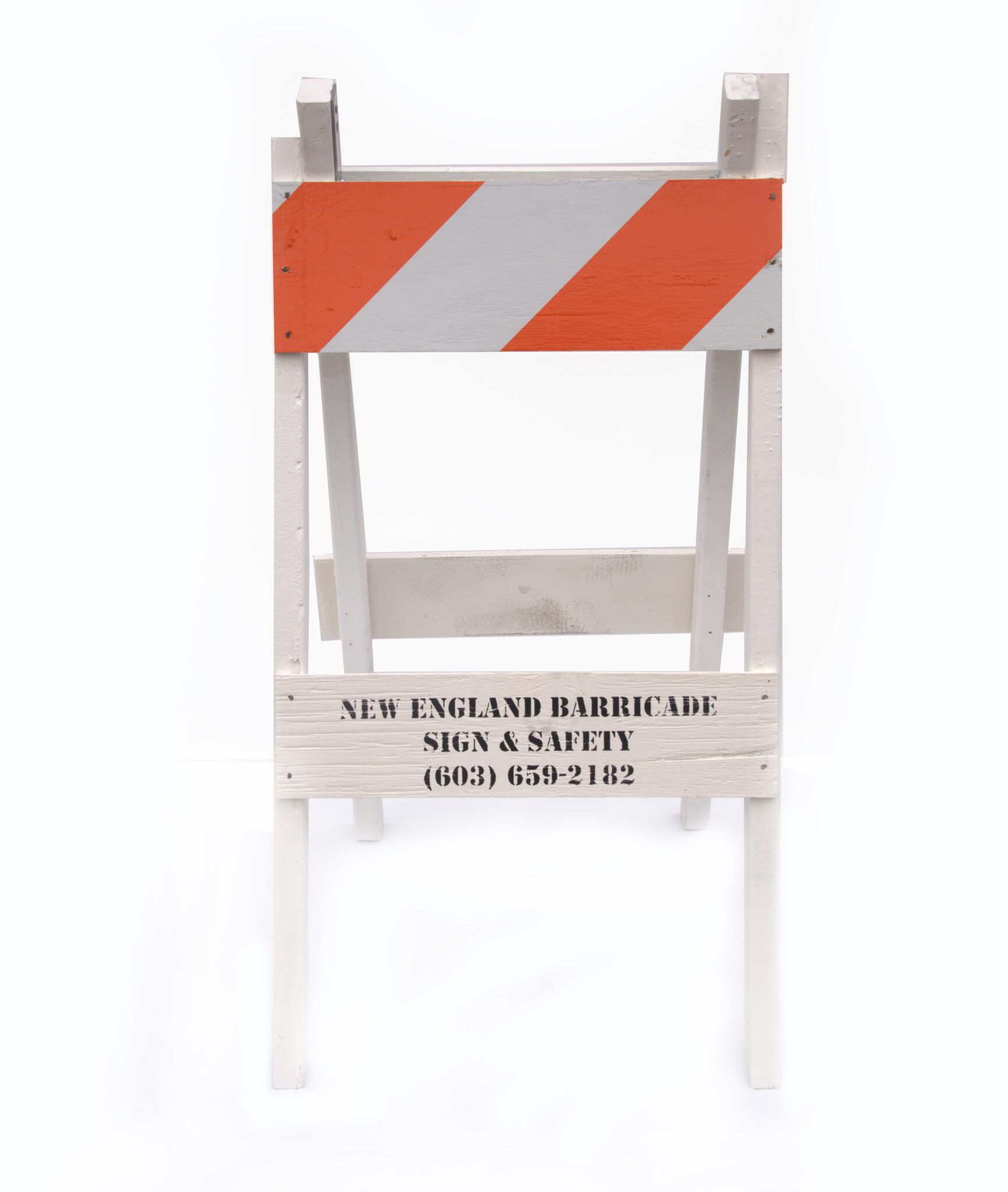 A white and orange barricade