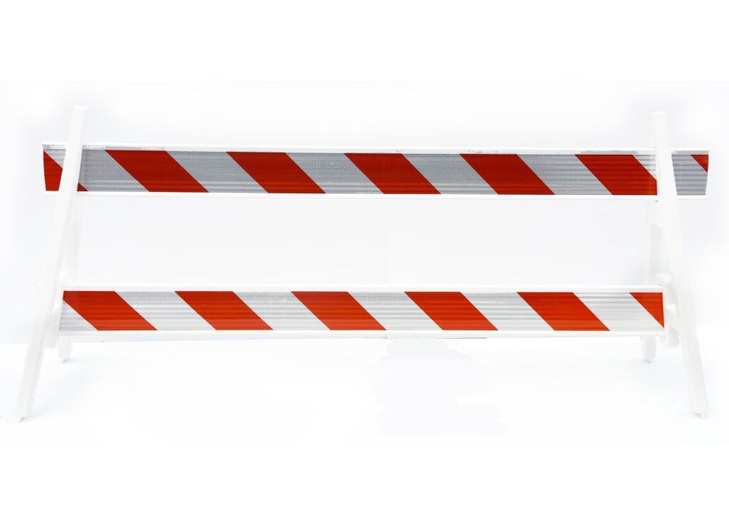 A red and white striped plastic barrier