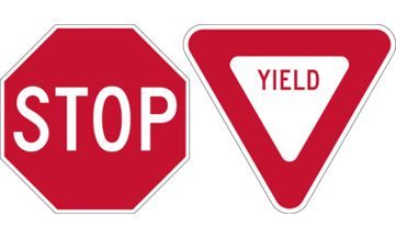 A stop sign and a yield sign on a white background