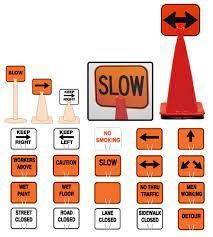 A set of orange traffic signs and cones on a white background.
