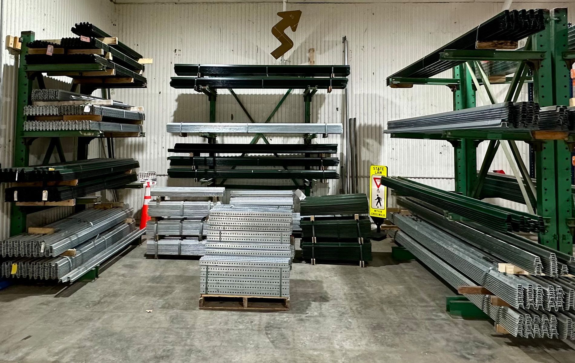 A warehouse filled with lots of metal pieces