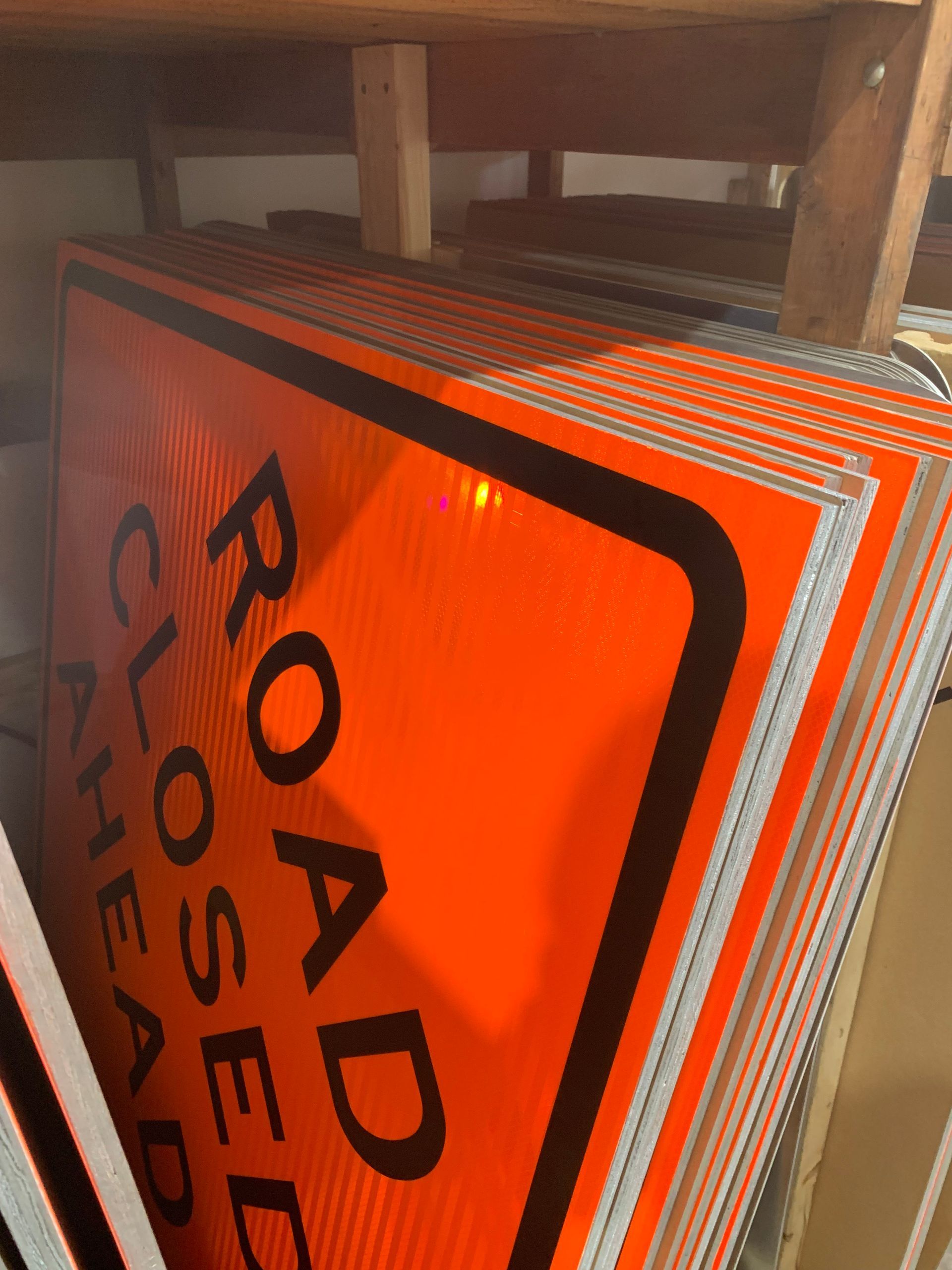 A stack of road closed signs sitting on top of each other