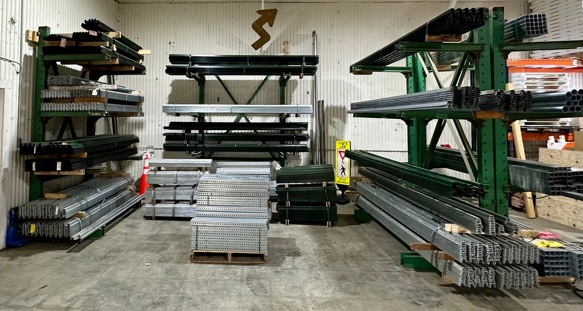 A warehouse filled with lots of metal pieces on shelves.