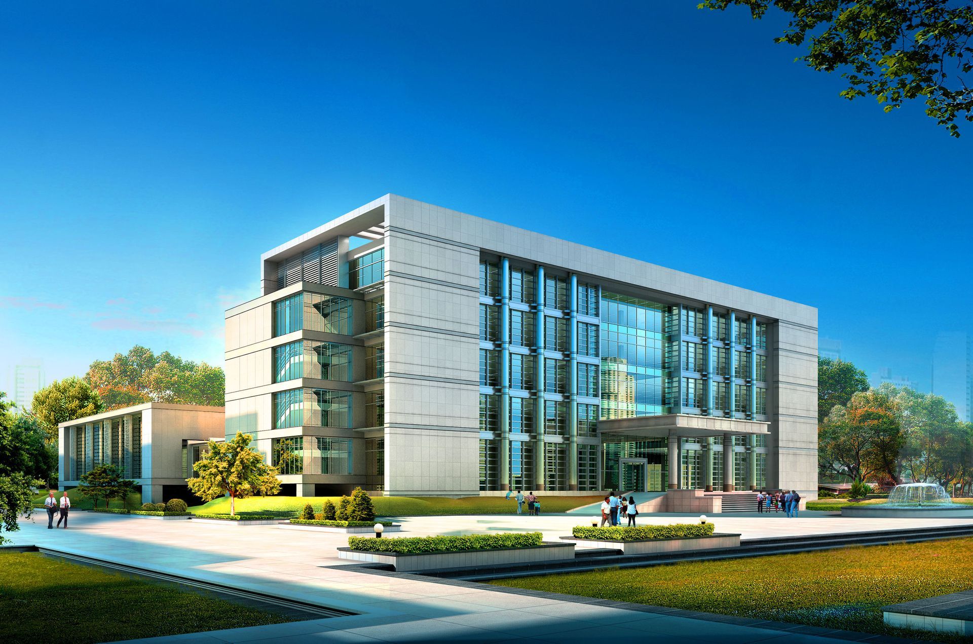 Modern glass office building with landscaped grounds under a clear blue sky