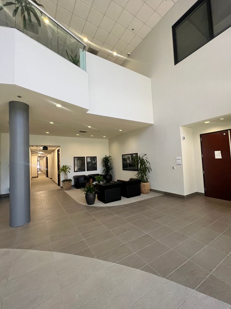 A large lobby with a staircase leading up to the second floor.
