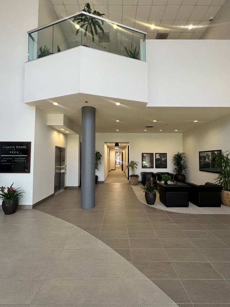 A lobby with a balcony.