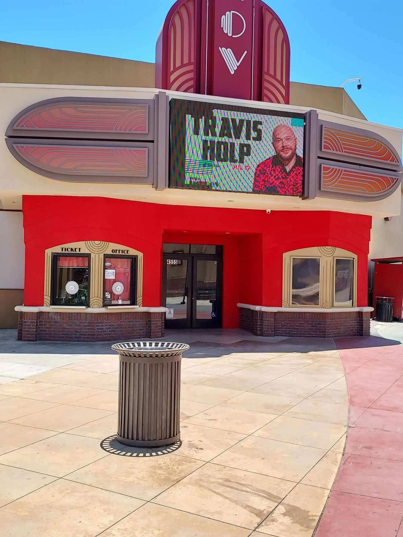 A large red building with a sign that says travis holt on it