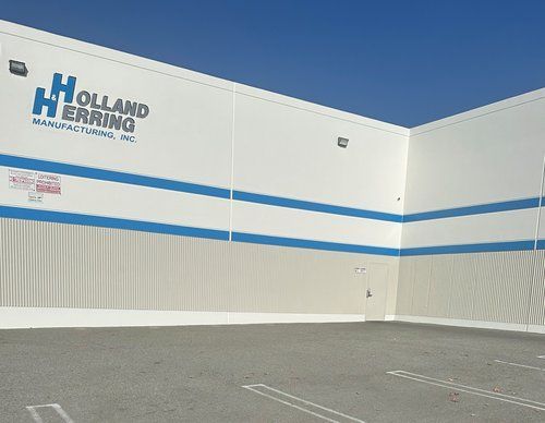 The outside of a building that says Holland Herring on it.
