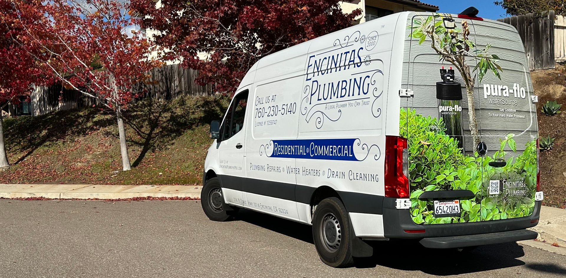 Encinitas Plumbing work van parked in a residential neighborhood in Encinitas, CA