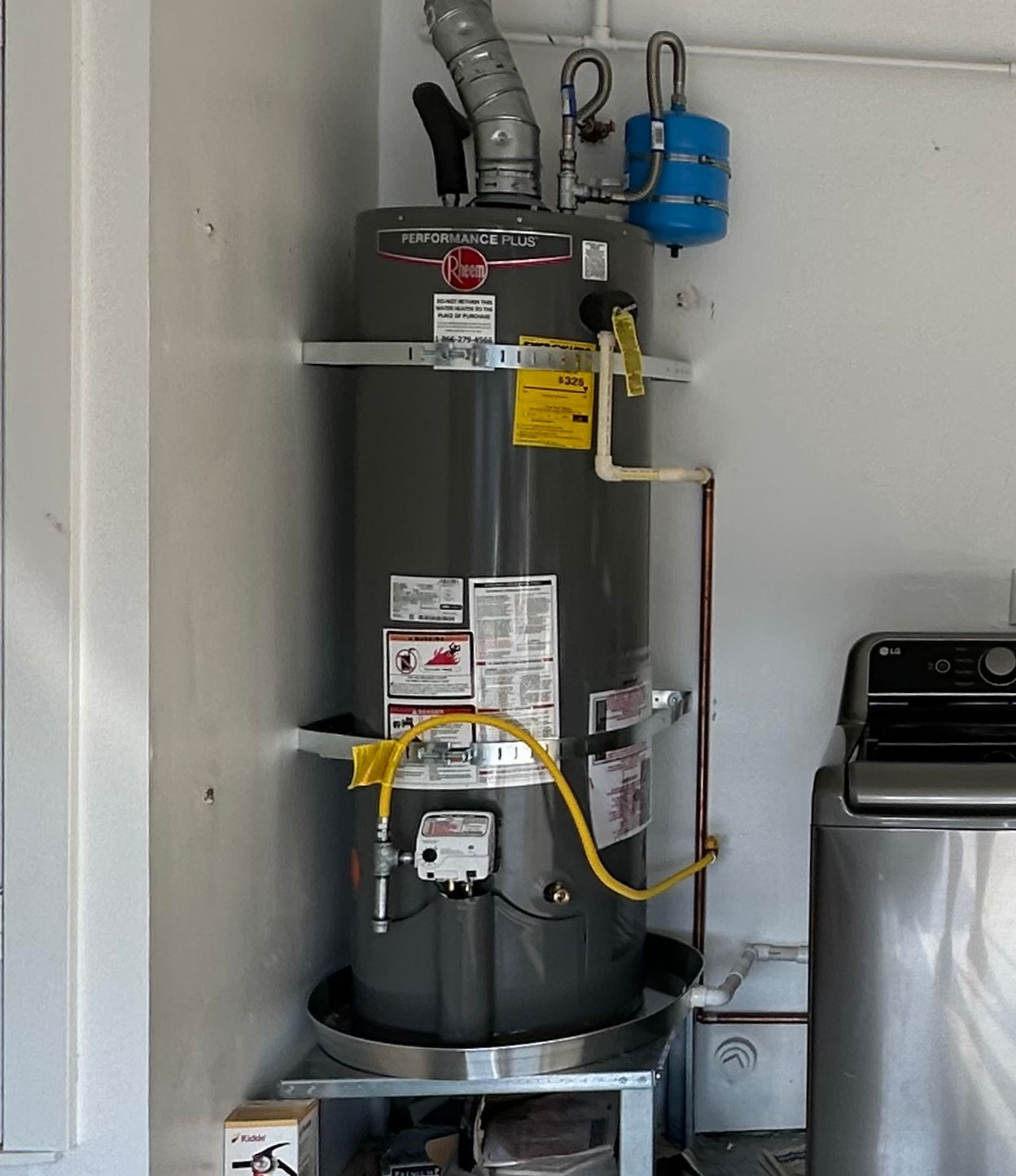 Installed residential water heater in Encinitas CA with code compliant piping and connections