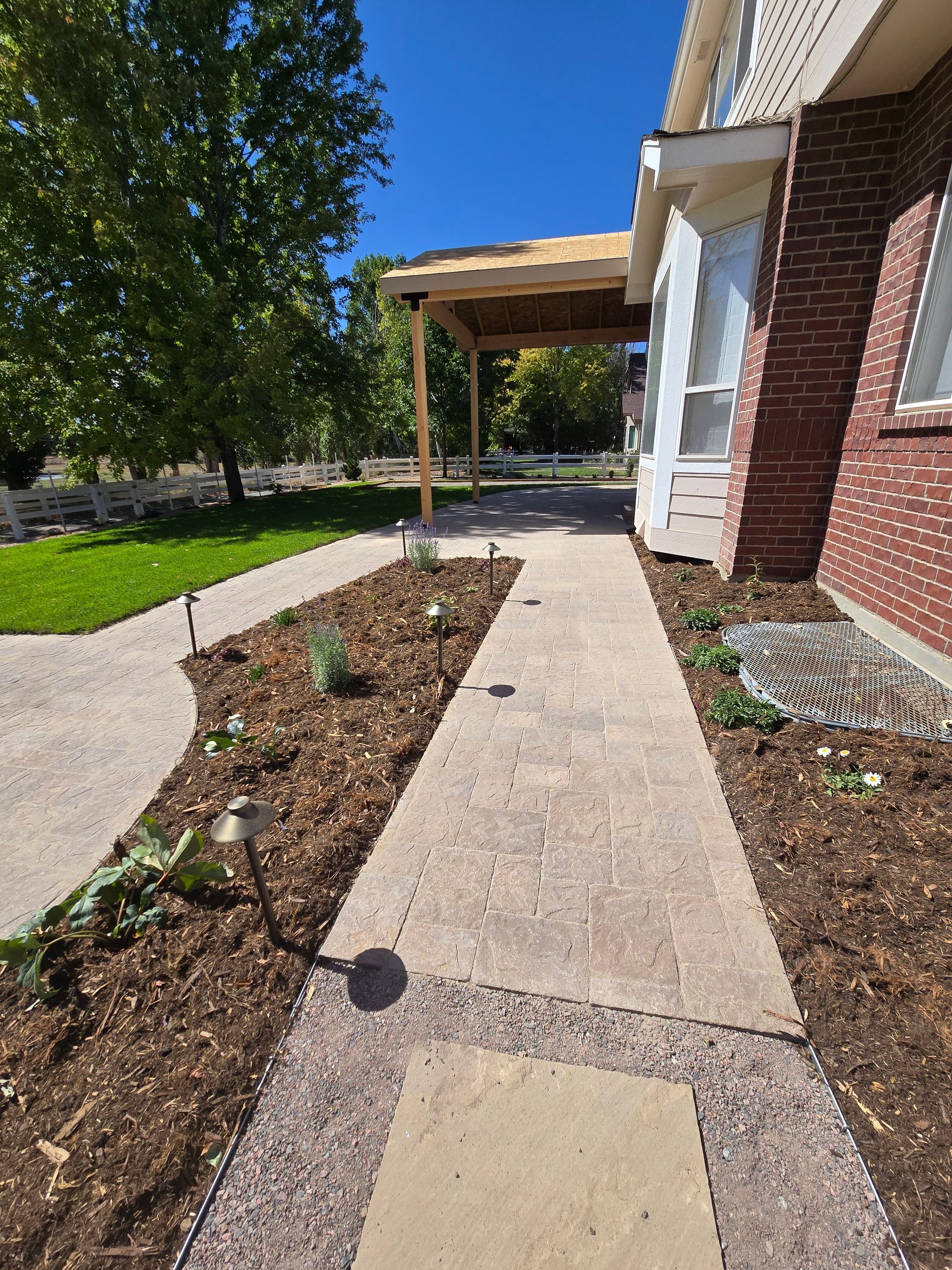 A brick house with a walkway leading to it