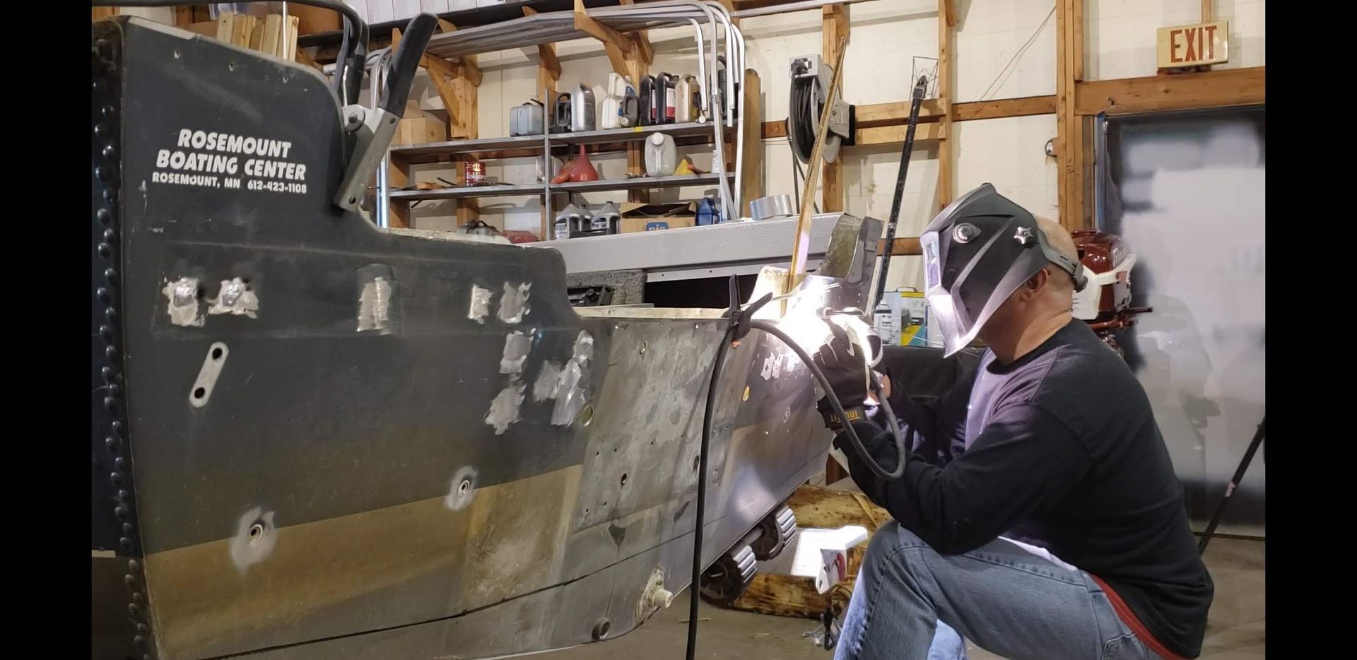 Aluminum boat transom repair and welding inside the Anchor Marine shop in Menomonie Wisconsin serving boat owners from Eau Claire and the Chippewa Valley