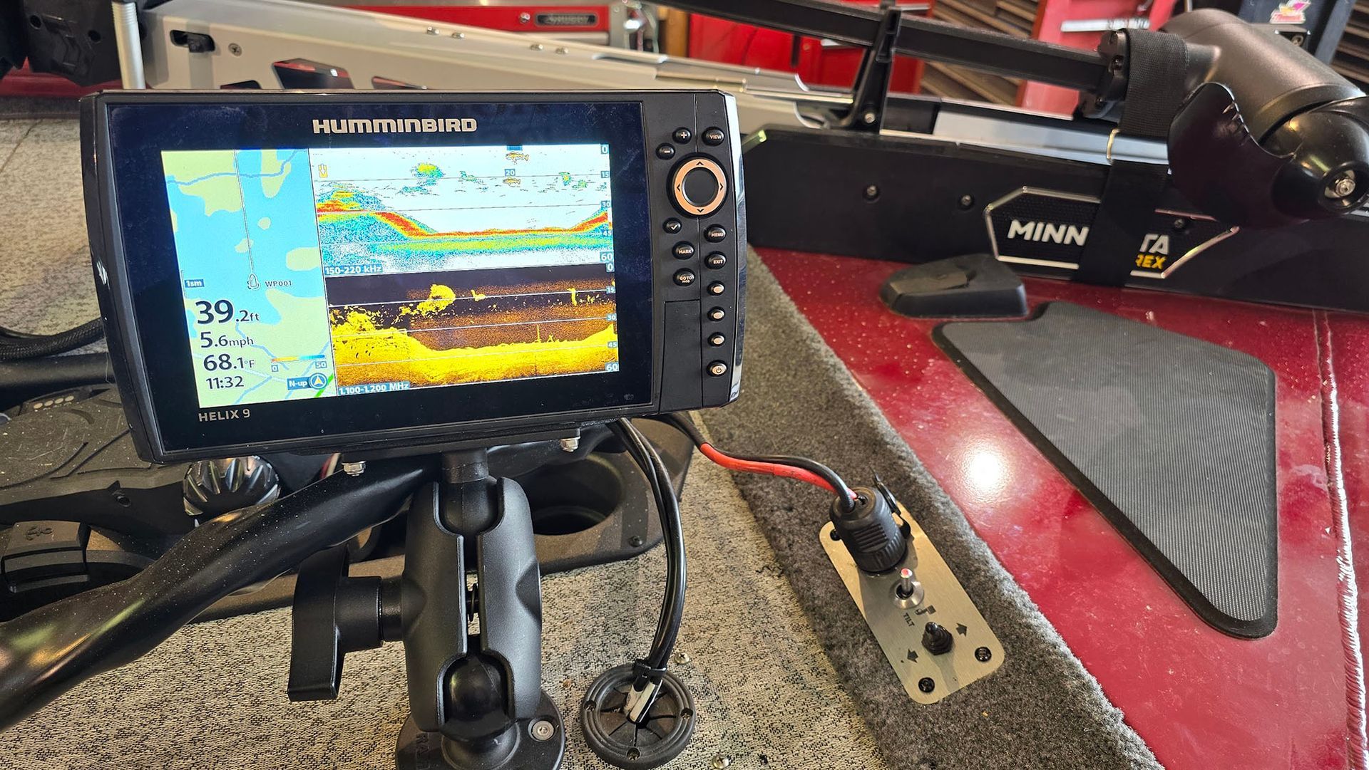 A fish finder is sitting on top of a boat.