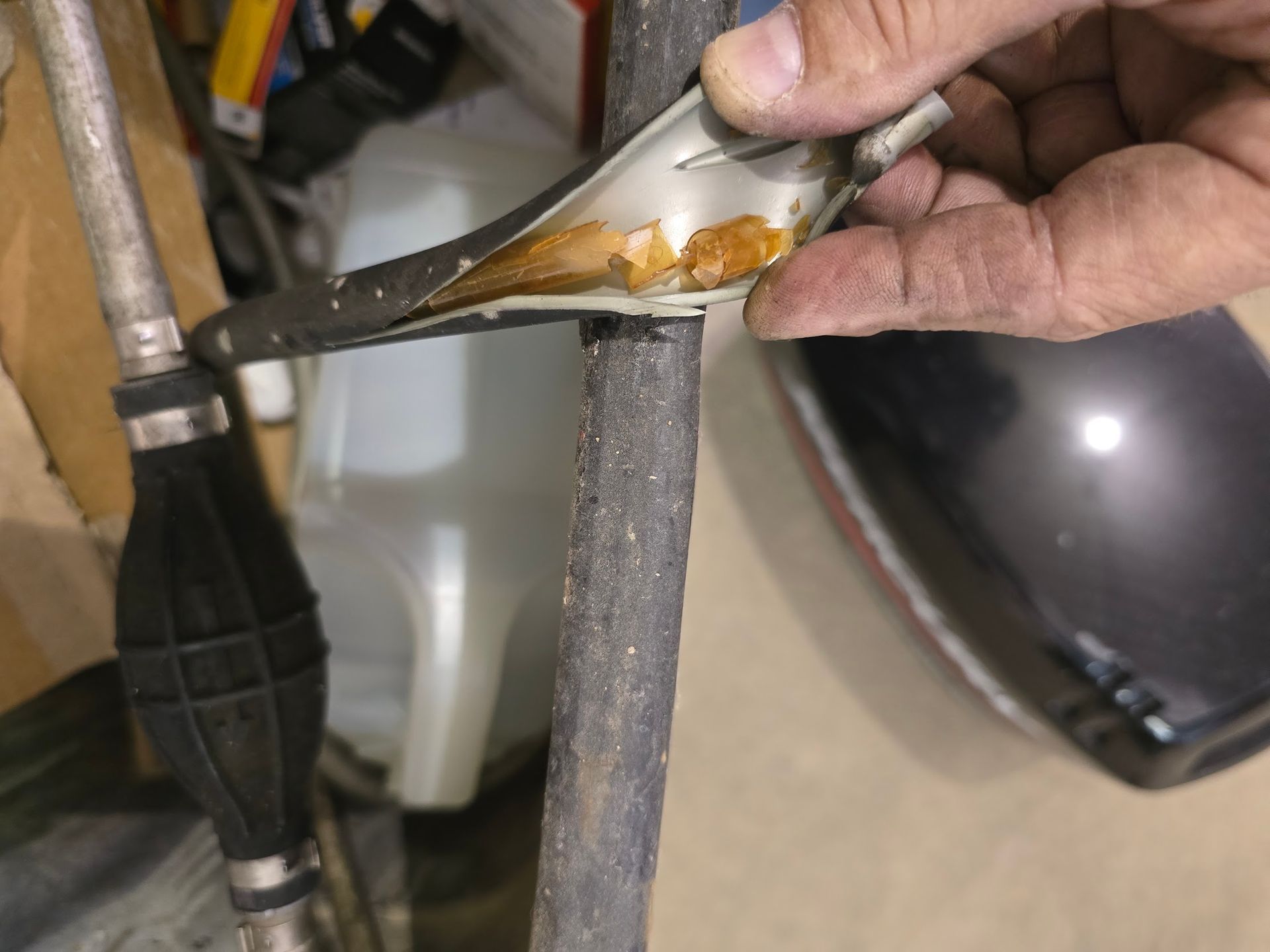 Degraded inner liner of a boat fuel hose caused by ethanol fuel exposure during outboard fuel system repair at Anchor Marine in Menomonie Wisconsin serving the Eau Claire boating area