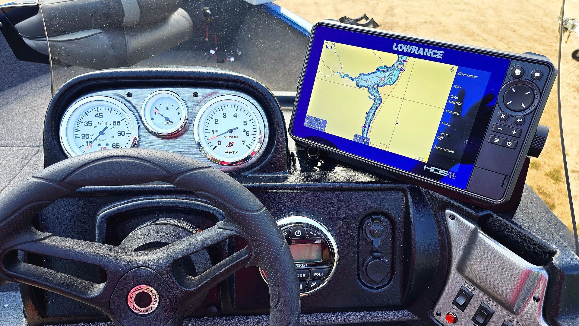 Lowrance HDS fish finder with Active Imaging mounted at boat console for GPS mapping and sonar