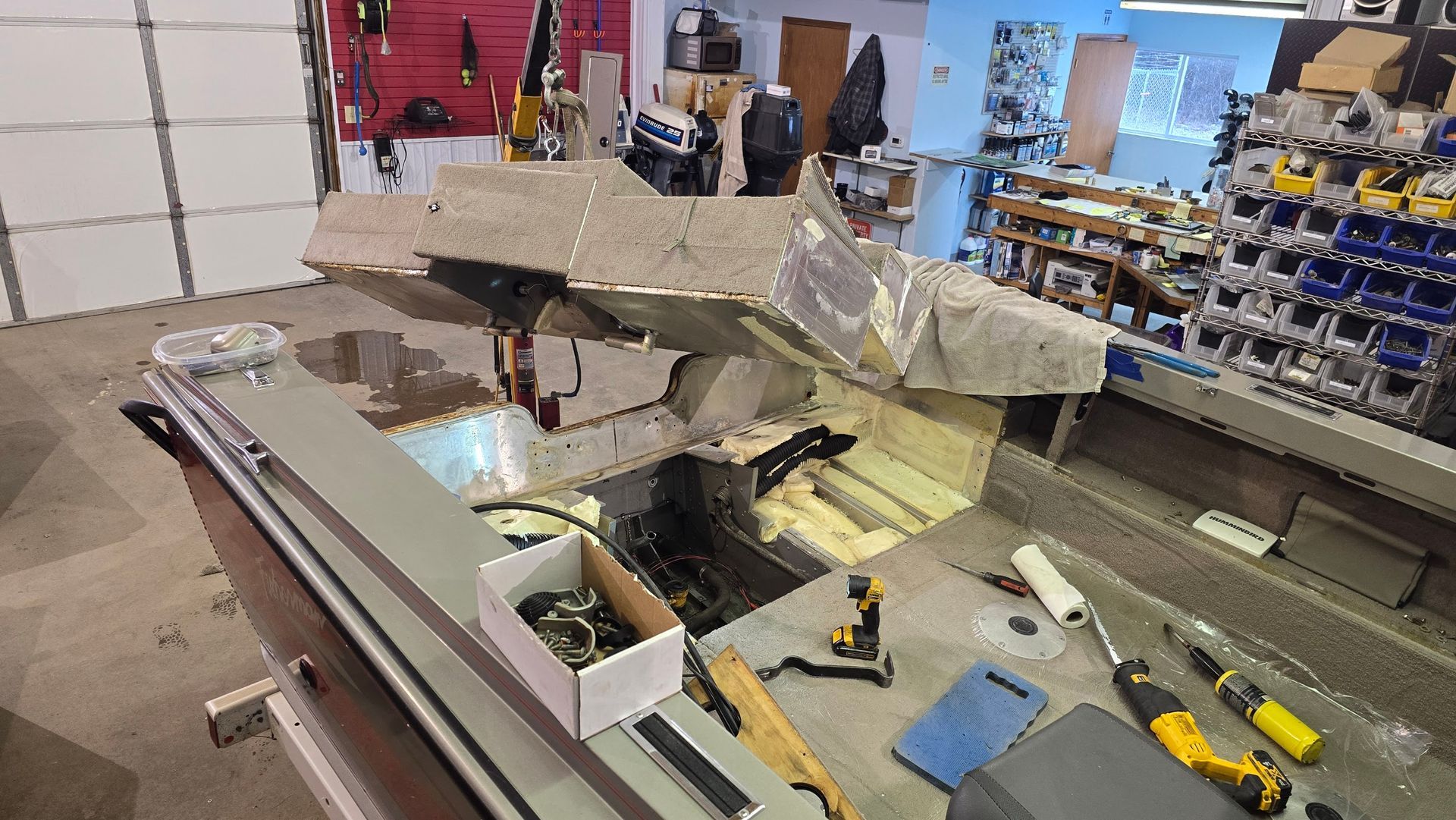 Lund Fisherman undergoing transom repair inside the Anchor Marine shop in Menomonie Wisconsin serving customers from Eau Claire and the Chippewa Valley