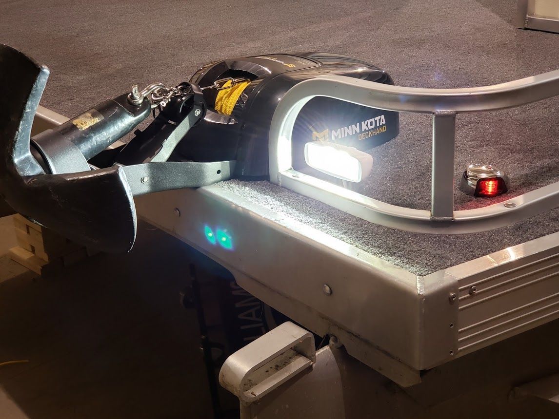 Minn Kota Deck Hand electric anchor system mounted on pontoon boat bow 