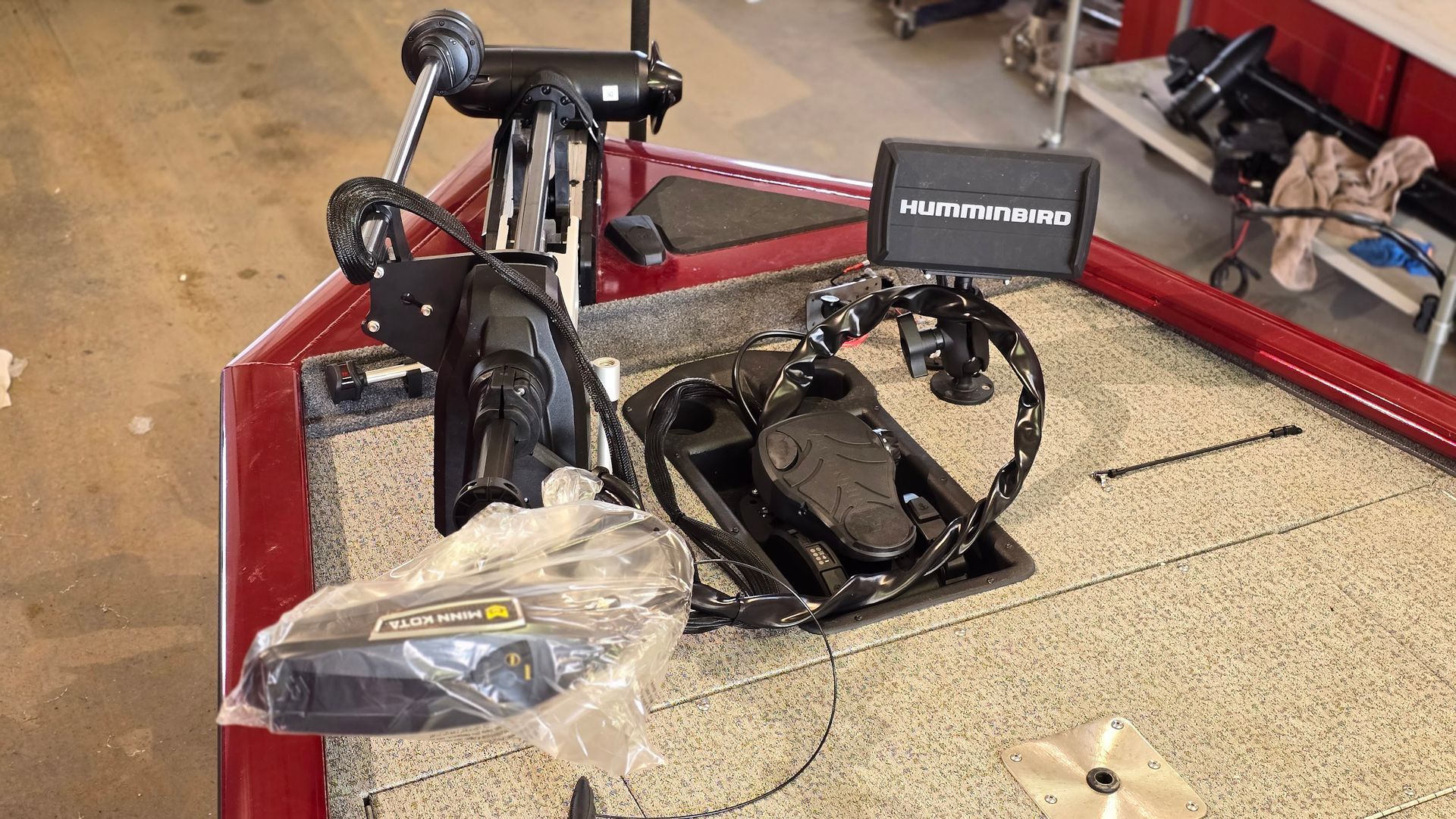 Minn Kota trolling motor with Humminbird fish finder and Mega 360 imaging installed on fishing boat at Anchor Marine boat repair shop in Menomonie Wisconsin serving the Eau Claire area