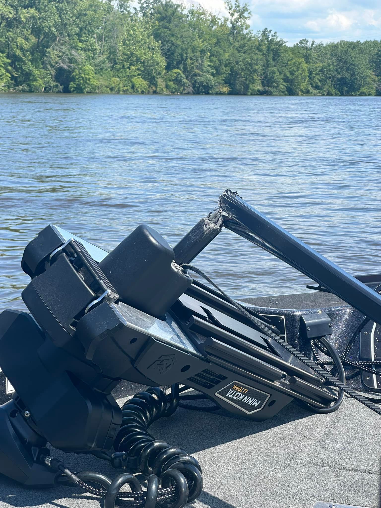 Damaged Minn Kota Ultrex trolling motor mount showing broken shaft before repair at Anchor Marine boat repair shop in Menomonie Wisconsin serving the Eau Claire area