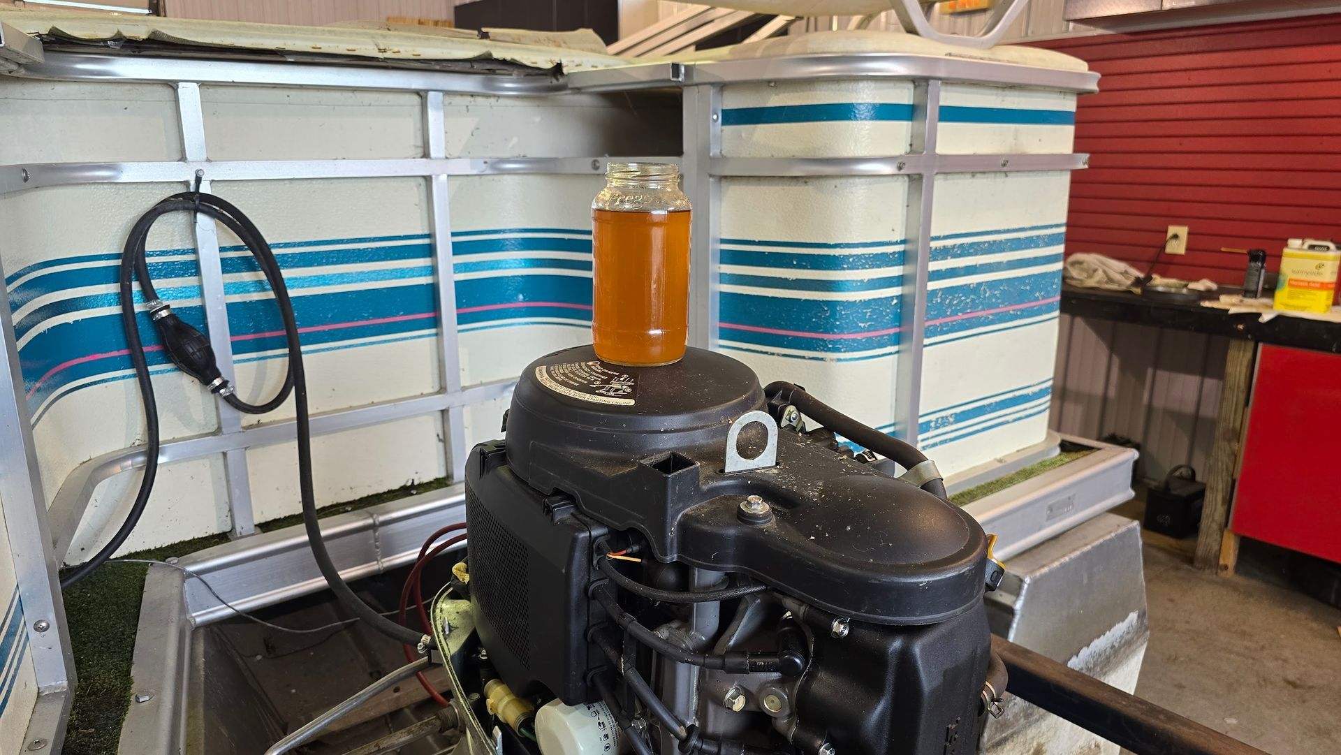 Sample of old degraded gasoline removed from a boat fuel system during outboard engine diagnosis at Anchor Marine in Menomonie Wisconsin serving Eau Claire area boat owners

