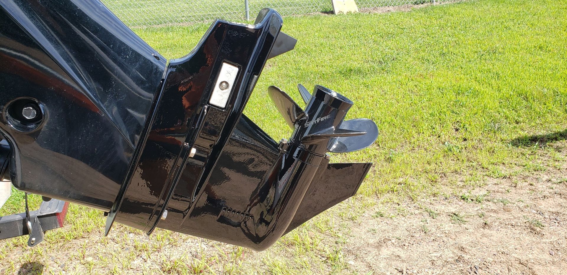 Finished outboard lower unit after skeg rebuild and cavitation plate repair with aluminum welding and refinishing at Anchor Marine boat repair shop in Menomonie Wisconsin serving the Eau Claire area