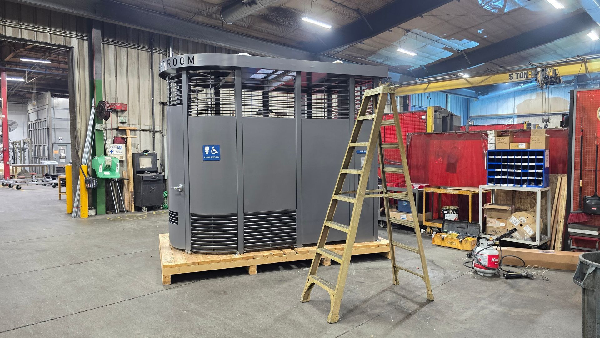 Portland Loo public restroom structure prepared for shrink wrap freight protection at Anchor Marine in Menomonie Wisconsin
