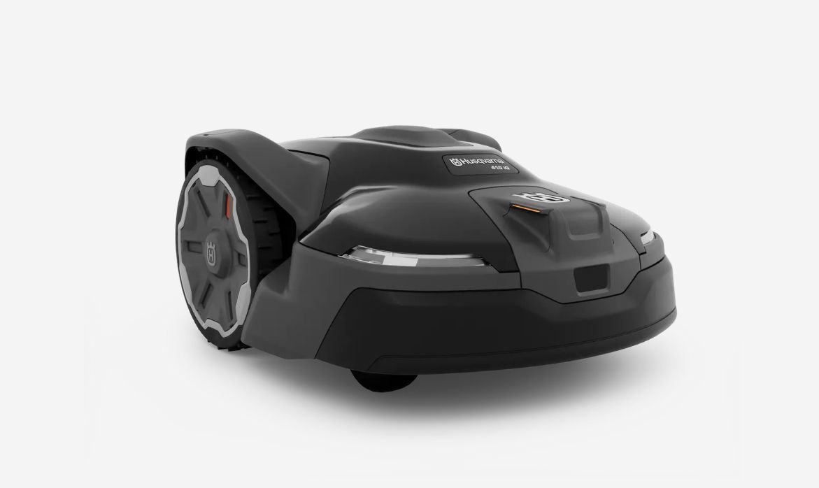 Black and gray robotic lawn mower on a white background.