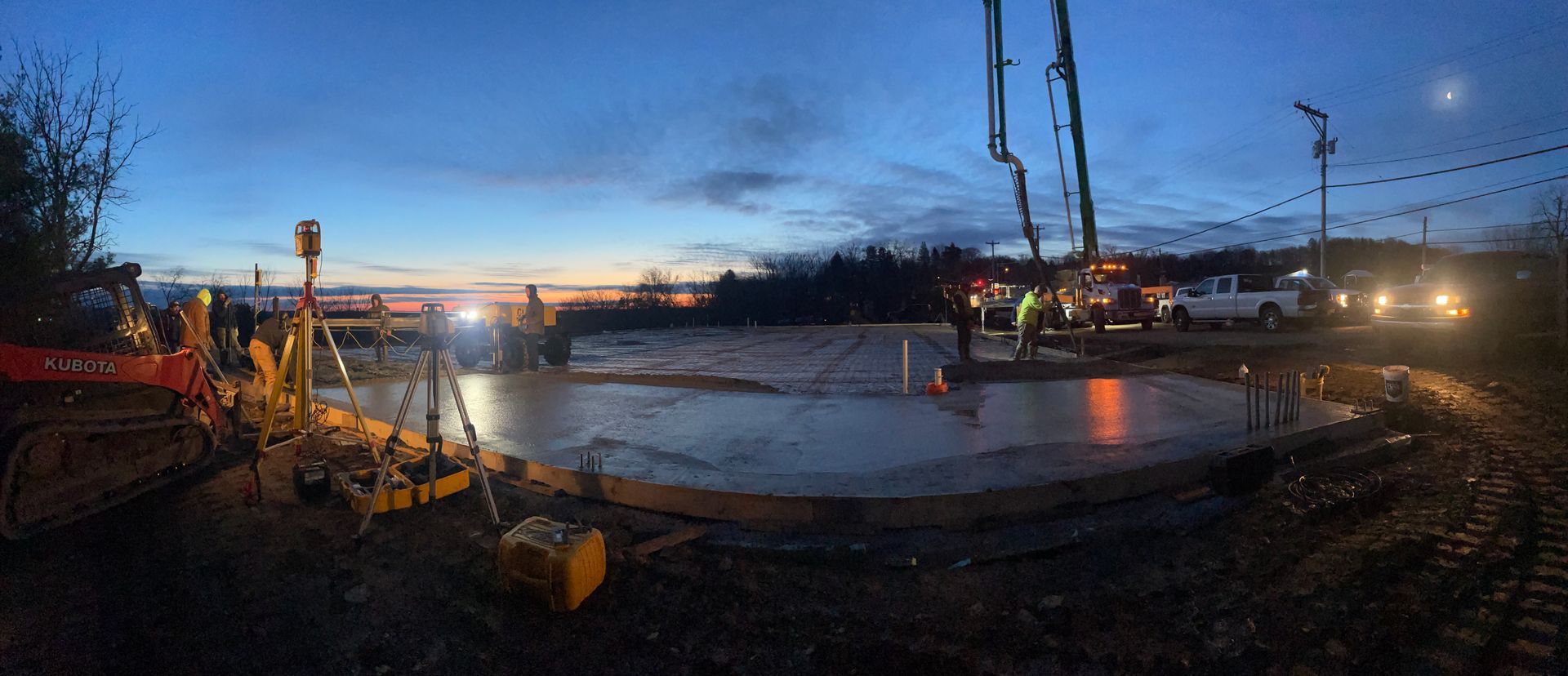 A panoramic view of a construction site at night.