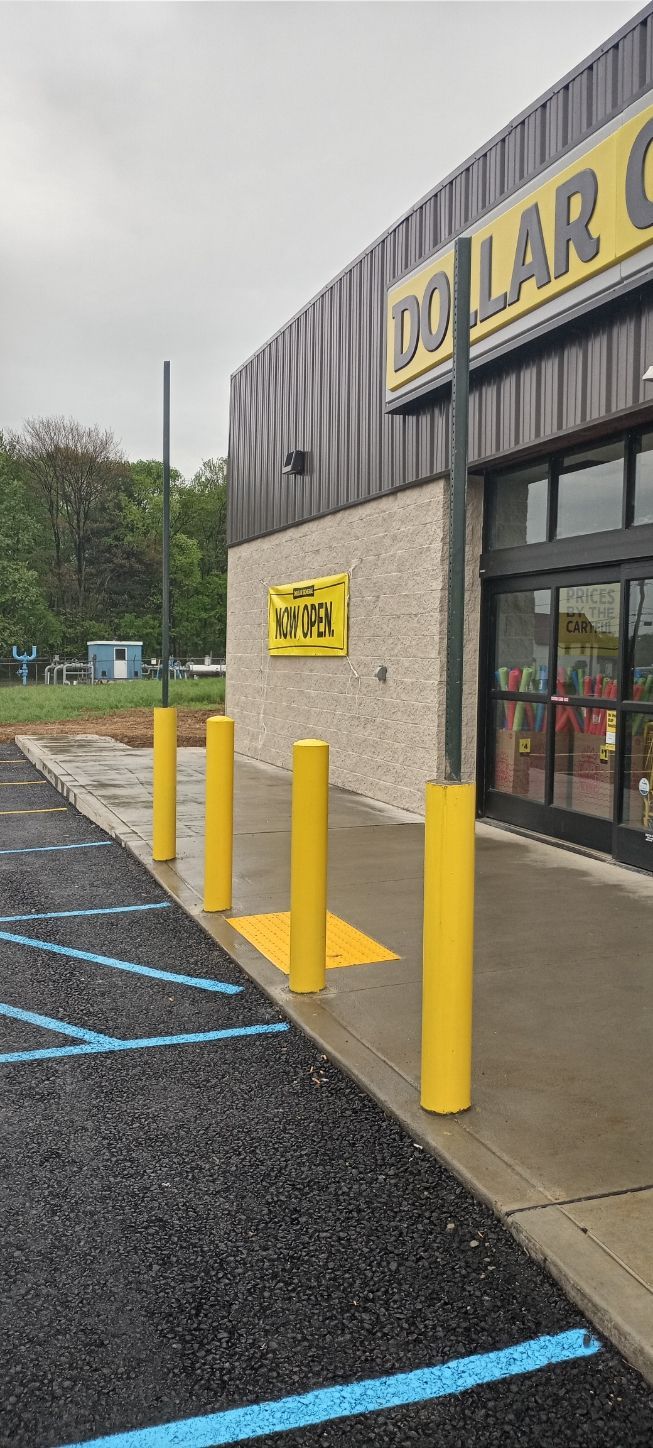 A dollar general store with a parking lot in front of it.